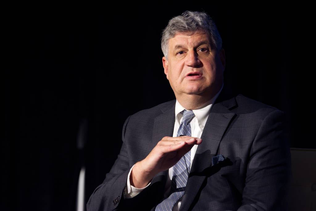 Undersecretary of Defense for Acquisition and Sustainment Bill LaPlante gestures as he speaks on stage Sept. 7, 2022, at the annual Defense News Conference.