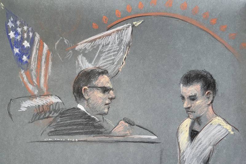 Massachusetts Air National Guardsman Jack Teixeira, right, appears in U.S. District Court in Boston, Friday, April 14, 2023.