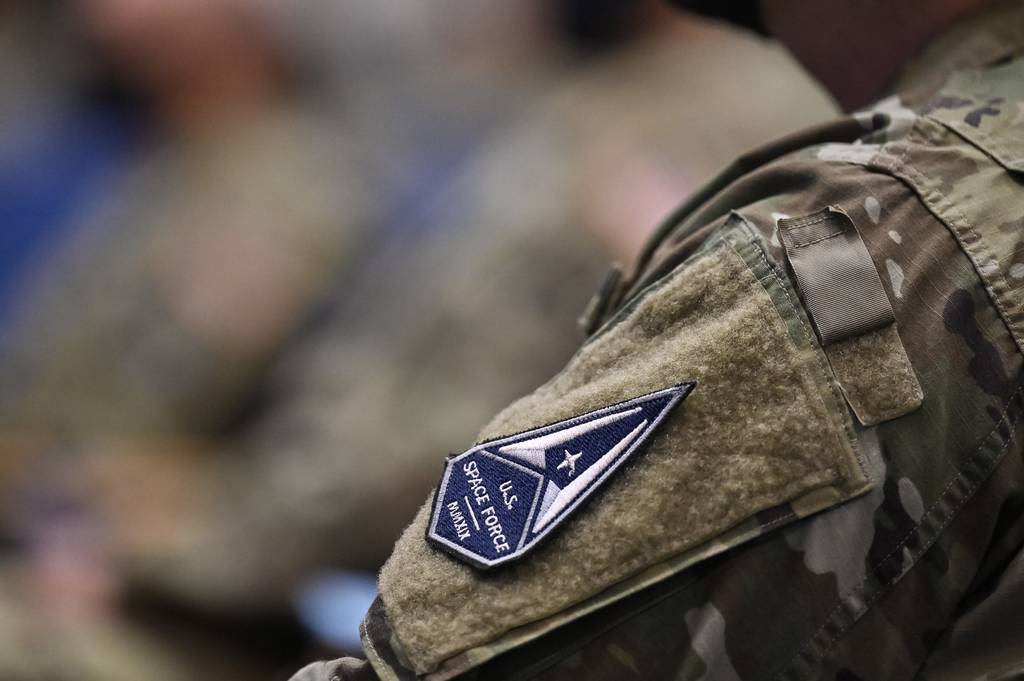 A Space Force patch is affixed to an officer's uniform after a ceremonial transfer event at the Pentagon, Arlington, Va., Aug. 2, 2021, for field grade officers recently approved for transfer into the Space Force.